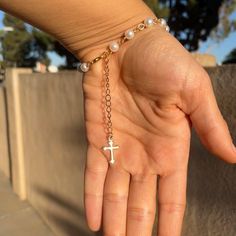 pearl bracelet with dangly cross made with copper wire and love ♡︎ finished with a lobster clasp ⭐️  the bracelet is 7 in long with a 2 in extension chain  length in the photos is on the shortest link  care tip: keep away from water to preserve its quality and appearance  instagram - @starrgirlfash depop - @starrgirlfash Cross Rosary, Jade Bead Necklace, Gold Pearl Jewelry, Rosary Bracelet, Jewelry Simple, Bracelet Ideas, A Cross, Jade Beads, Simple Jewelry