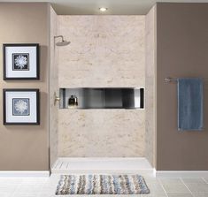 a modern bathroom with beige walls and white tile flooring, including a shower stall