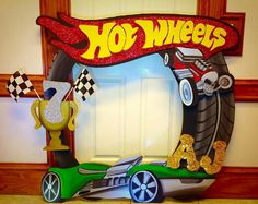 a photo frame made to look like a car with the word hot wheels on it