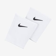 two white napkins with black nike logo on them