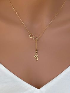 Sterling silver music charm necklace. Sterling Silver Treble Clef Music Charm. The perfect silver charm for music lovers and musicians. Sterling Silver Music Note Charm - Treble Clef 18x7mm This necklace is made of.... -18x7 S24k gold fill Music Note Charm - Treble Clef, -Gold plated on Sterling Silver infinity charm, -14k Gold Fill cable chain with spring clasp, -Come up with beautiful ribbon gift box and -One set of Care instruction package. MORE RELIGION NECKLACES https://www.etsy.com/shop/ra Music-themed Charm Jewelry As A Gift, Music-themed Charms Jewelry For Gifts, Music-themed Charms Jewelry As Gift, Music-themed Jewelry Charms For Gifts, Music Note Jewelry, Piano Teacher Gift, Music Necklace, Gift For Musician, South San Francisco