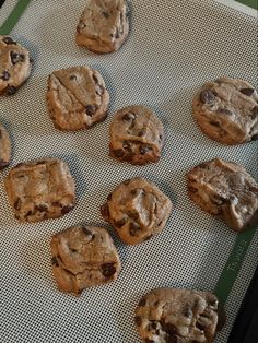 chocolate chip cookies on a baking sheet ready for the oven to be baked in or out