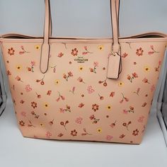 Brand: Coach Style: Mystical Floral Print City Tote / C8743 Condition: New With Tag Exterior Color: Faded Blush Multi Interior Features: Inside Zip Pocket Closure: Magnetic Snap Hardware Color: Gold Straps: Two Shoulder Straps Approx. Measurements: 13" L X 11.5" H X 6.25" W Includes: Coach Hangtag No Lowball Offers Or Trades Please. I Do Not Discuss Prices On Listings. Thank You For Looking! Coach Blush Bag For Everyday Use, Blush Coach Bag For Everyday Use, Feminine Coach Bags For Everyday Use, Coach Floral Print Bags For Everyday Use, Coach Everyday Bags For Spring, Coach Bags For Everyday Spring Use, Spring Coach Everyday Bags, Spring Coach Bags For Everyday Use, Coach Travel Bag For Spring