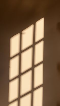 the shadow of a clock on a wall