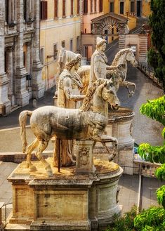 the statues are on display in front of the city's old town buildings and cobblestone streets