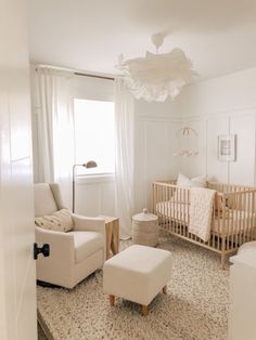 a baby's room with two cribs, a chair and a footstool