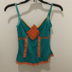 It's Perfect For Teens Orange Vest Top For Spring, Fitted Green Vest Top, Green Cotton Camisole, Orange Sleeveless Cotton Tank Top, Orange Cotton Sleeveless Tank Top, Orange Stretch Tank Top, Green Cotton Tank Camisole, Orange Camisole Tank Top For Spring, Multicolor Fitted Cami Top