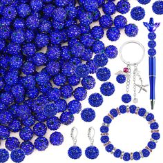 blue beads and accessories are arranged on a white surface