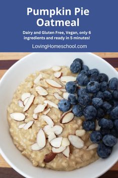 oatmeal with blueberries and almonds in a white bowl on a wooden table