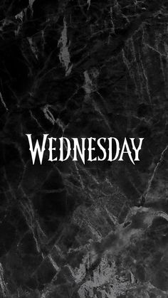 the words wednesday written in white on a black marble background