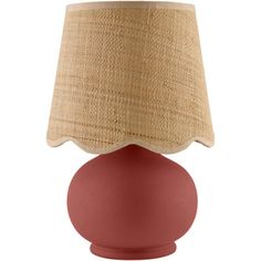 a red table lamp with a beige shade on the top and bottom part of it