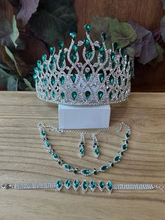 a tiara, bracelet and necklace on a table