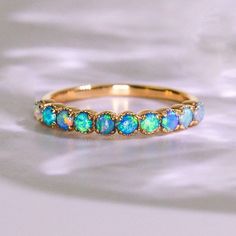 Yellow Gold Opal Ring With Halo, Yellow Gold Opal Ring With Prong Setting, Yellow Gold Multi-stone Opal Ring For Anniversary, Stackable Yellow Gold Opal Ring For Anniversary, Stackable Opal Ring In Yellow Gold For Anniversary, Fine Jewelry Stackable Opal Ring With Round Band, 14k Gold Opal Ring With Halo Design, Fine Jewelry Yellow Gold Opal Ring With Prong Setting, 14k Yellow Gold Opal Ring With Halo