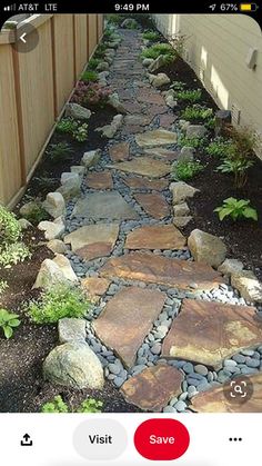 a stone path in front of a house