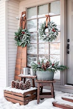 Capture the essence of winter with this enchanting porch setup. Frosted window panes, rustic wooden accents, and pinecone arrangements bring a touch of nature's beauty to your doorstep. Pinecone Arrangements, Frosted Window, Window Panes