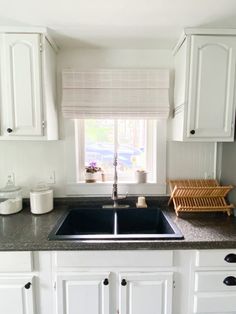 the kitchen sink is clean and ready for us to use it's counter tops