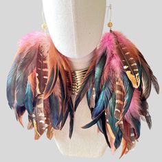 Pink Schlappen and Venery Pheasant Wing Feathers. These Boho dangle earrings are handmade in the USA with natural feathers. These Boho Stylish, Chic, and Elegant Feather Dangle Earrings are a statement piece for all Unique Women. The feather earrings are made with Natural Pink Schlappen and Venery Pheasant Wing Feather Earring. These Dangle Earrings are connected on a chain. The Feathers are approximately 8”-12” long from top to bottom. All our Feathers are treated under high-temperature sterili Wing Feathers, Unique Women, Bleach Dye, Chic And Elegant, Pink Boho, Pheasant, Feather Earrings, Colorful Boho, High Temperature