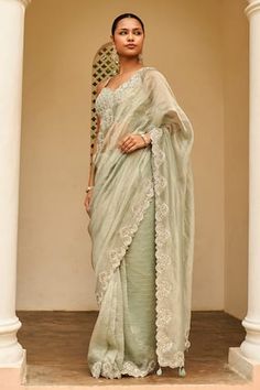 Pastel grey saree with stripe pattern and zardozi, aari, french knots, dori embroidered border. Paired with checkered embroidered blouse.
Components: 2
Pattern: Embroidery
Type Of Work: Zardozi, Aari, French Knots, Dori
Neckline: Sweetheart neck
Sleeve Type: Sleeveless
Fabric: Tissue
Color: Grey
Other Details: 
Cutwork bordered saree
Inverted V hem blouse
Occasion: Reception - Aza Fashions Embroidery Zardozi, Pakistan Clothes, Grey Saree, Zardozi Embroidery, Pastel Grey, Border Saree, Black Sleeveless Blouse, Hem Blouse, French Knots