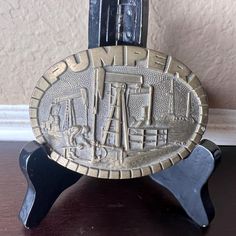 Vintage 1980's solid brass 'Pumper' belt buckle, Made by 'Award Design Medals' and featuring a raised and gritty design of a roughneck working hard underneath an oil rig / pump.  Perfect gift for men who dress in the western or cowboy style, Texas fans, collectors of petroliana, etc. Size: 4" x 2.75" Condition: Nice aged patina to brass. Quality constructed piece. Raised design is crisp and precise (good manufacturing quality control of brass molds). Highly collectible. NPK- Cowboy Outfit, Award Design, Brass Belt, Brass Belt Buckles, Cowboy Outfits, Cowboy Style, Oil Rig, Cow Boy, Belt Buckle