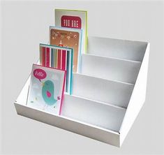 an assortment of greeting cards in a white box