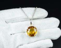 Gemstone- Yellow Sapphire Gemstone Shape-  Round  Cut  Stone Size - 17 MM Metal-925 Sterling Silver This One of a kind Pendant is adorned with beautiful Sapphire Gemstone set in sterling silver. About gemstones-Sapphire is one of the two gem-varieties of corundum, the other being ruby (defined as corundum in a shade of red). Although blue is the best-known sapphire color, they occur in other colors, including gray and black, and also can be colorless. A pinkish orange variety of sapphire is call Sterling Silver Round Cut Jewelry Gift, Gift Sterling Silver Round Cut Jewelry, White Gold Sterling Silver Gemstones With Round Stone, Silver Citrine Gemstones For Fine Jewelry, Faceted Citrine Pendant Jewelry, Faceted Round Topaz Jewelry, Diamond Cut Cubic Zirconia Gemstones For Gifts, Cubic Zirconia Diamond Cut Gemstones For Gift, Round Faceted Topaz Jewelry