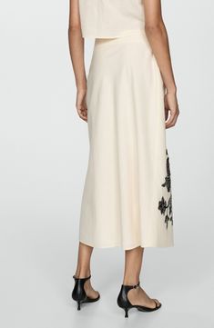 A cotton and linen fabrication adds lightweight charm to this A-line midi skirt detailed with charming floral print twining its way up one side. Concealed-elastic waist Cotton lining 90% cotton, 10% linen Machine wash, line dry Imported Spring Embroidered Beige Skirt, Spring A-line Skirt With Floral Embroidery, Flowy Cotton Skirt With Floral Embroidery, Elegant Cotton Maxi Skirt For Spring, Elegant Cotton Embroidered Skirt, Elegant Cotton Skirt With Floral Embroidery, Elegant Cotton Skirt With Embroidery, Elegant Embroidered Cotton Skirt, Embroidered Midi Skirt For Summer