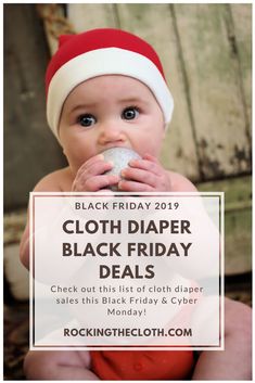 a baby wearing a santa hat is holding a sign that says, black friday 2019 cloth diaper black friday deal