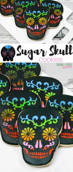 sugar skull cookies are decorated with black icing and colorful sugar skulls on the top