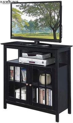 an entertainment center with a flat screen tv on top of it