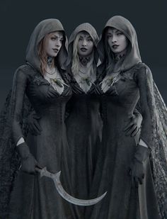 three women dressed in gothic clothing standing next to each other