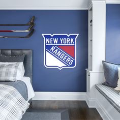 the new york rangers wall decal is shown in this bedroom