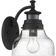 a light that is on the side of a wall with a glass bulb attached to it