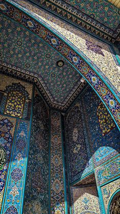 an intricately decorated building with blue and green tiles