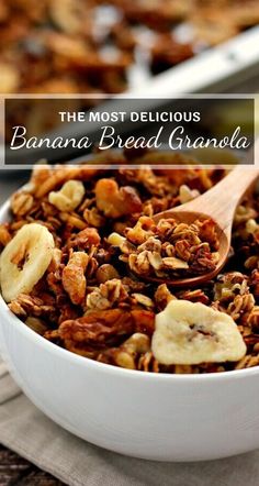 the most delicious banana bread granola is in a white bowl with a wooden spoon