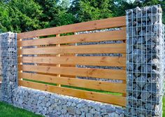 a fence made out of rocks and wood