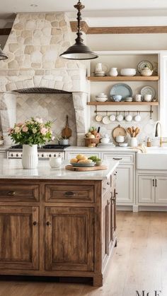 a kitchen with an oven, sink and counter tops in it's center island