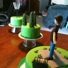 two cakes decorated to look like golf players