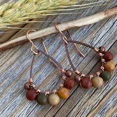 Red Creek Jasper and Copper Teardrop Earrings wrapped with copper wire and includes a Nickel Free Ear-Wire: These earrings are light weight, comfortable, simple and fun. Throw them on with any outfit and they will definitely add some pop. Perfect if you are looking for a Rustic Boho look! They are approximately 1.5 inches in length and .75 inches at the widest portion. All of these items are handmade so please allow for possible slight variance in sizing. If you would like these in a different c Adjustable Wire Wrapped Bohemian Teardrop Earrings, Bohemian Adjustable Wire Wrapped Teardrop Earrings, Wire Wrapped Copper Teardrop Earrings, Rust Dangle Earrings With Ear Wire, Rust Color Dangle Earrings With Ear Wire, Bohemian Hand Wrapped Brown Earrings, Rust Teardrop Handmade Jewelry, Bohemian Brown Hand Wrapped Earrings, Bohemian Brown Hand-wrapped Earrings