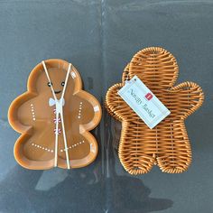 a cookie shaped like a ginger next to a wicker clock