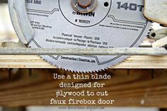 a close up of a circular saw on top of a piece of wood with the words use a thin blade designed for plywood to cut faux firebox door