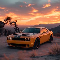 a yellow sports car parked in the desert