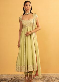 Elevate your ethnic wardrobe with the stunning Pastel Green Chanderi Silk Anarkali Set. Crafted from luxurious chanderi and georgette fabrics, the light green anarkali is adorned with exquisite gota work, radiating grace and sophistication. Paired with a finely tailored churidar and completed with a delicate net dupatta, creating a harmonious ensemble perfect for Mehndi, festivals and wedding guests. Composition : Anarkali - Chanderi and Georgette, Churidar - Semi Crepe and Dupatta - Soft Net Care: Dry Clean Only and Vacuum Storage This product can be customized for sleeves, length and colour Delivery : 4-6 weeks as the product is hand crafted. Check Size Guide or choose MySize for free customisation (All Sizes above XL can be made at 15% additional cost) For more information and sizes ple Anarkali Designs Latest, Light Green Anarkali, Simple Anarkali, Chanderi Anarkali, Anarkali Designs, Anarkali Churidar, Green Anarkali, Designer Anarkali Dresses, Silk Anarkali