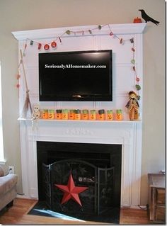 a living room with a fire place and a flat screen tv mounted on the wall