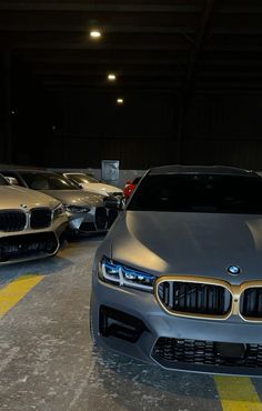 two cars parked in a parking garage next to each other