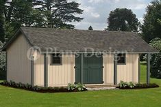 a small shed sitting on top of a lush green field