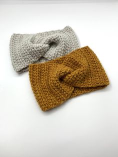 two crocheted headbands on top of each other, one with a knot