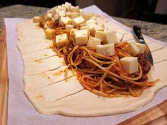 the pizza dough has been prepared and ready to be eaten with some cheese on top