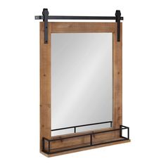 a wooden mirror and shelf with metal handles