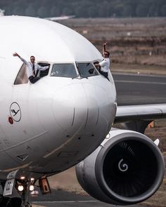 a large jetliner sitting on top of an airport tarmac next to a runway