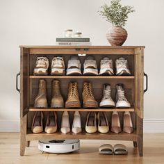 a wooden shelf filled with lots of shoes